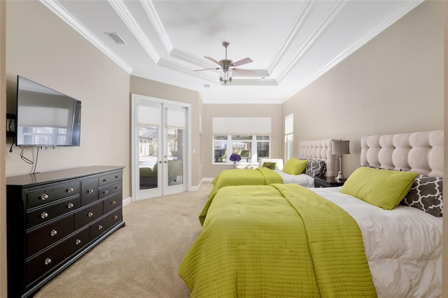 bedroom with visible vents, a raised ceiling, light colored carpet, ornamental molding, and access to outside