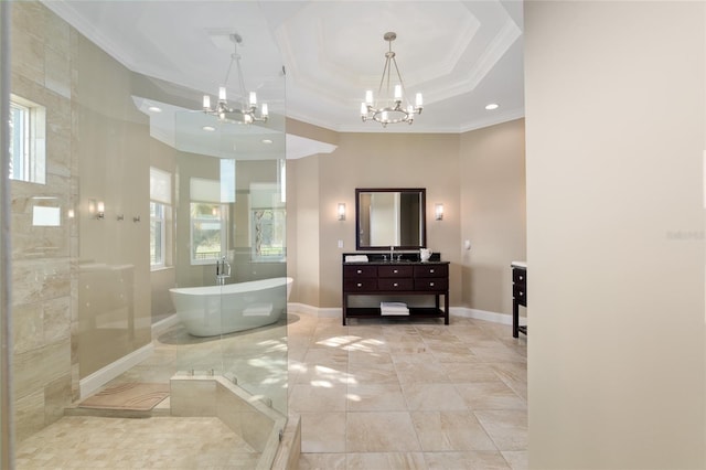 full bathroom with a freestanding tub, baseboards, a chandelier, and vanity