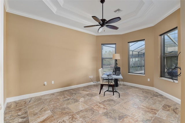 unfurnished room with a tray ceiling, visible vents, crown molding, and baseboards