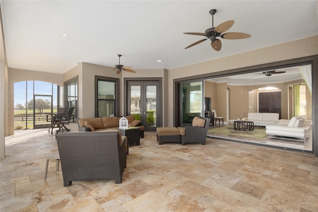 view of patio / terrace featuring an outdoor hangout area, french doors, a lanai, and a ceiling fan