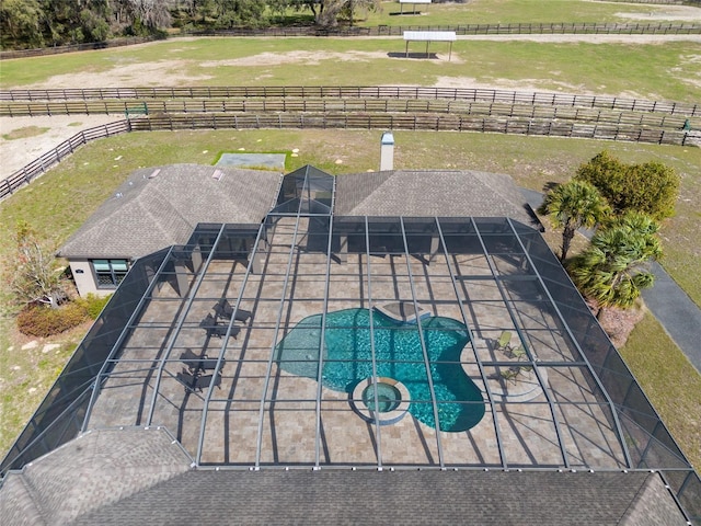 birds eye view of property with a rural view