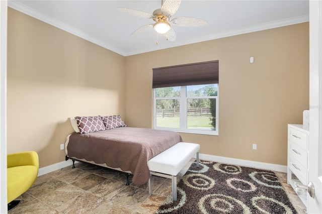 bedroom featuring baseboards, a ceiling fan, and crown molding