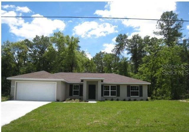 ranch-style home with a garage, concrete driveway, a front yard, and stucco siding