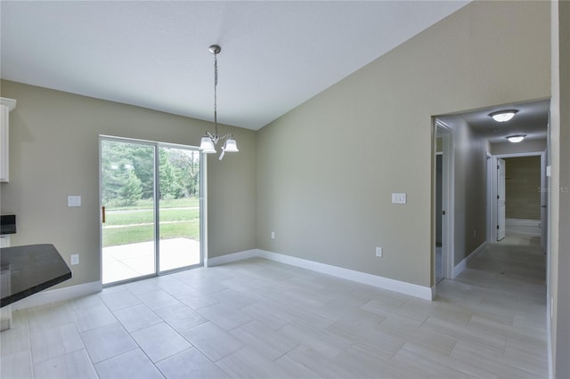 unfurnished dining area with lofted ceiling, baseboards, and a chandelier