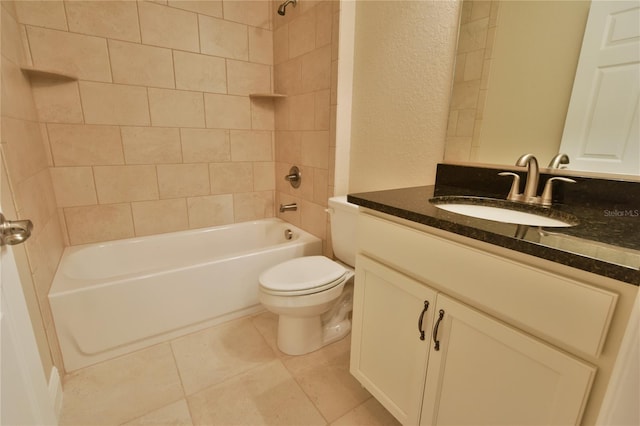 full bath with a textured wall, shower / tub combination, toilet, vanity, and tile patterned floors