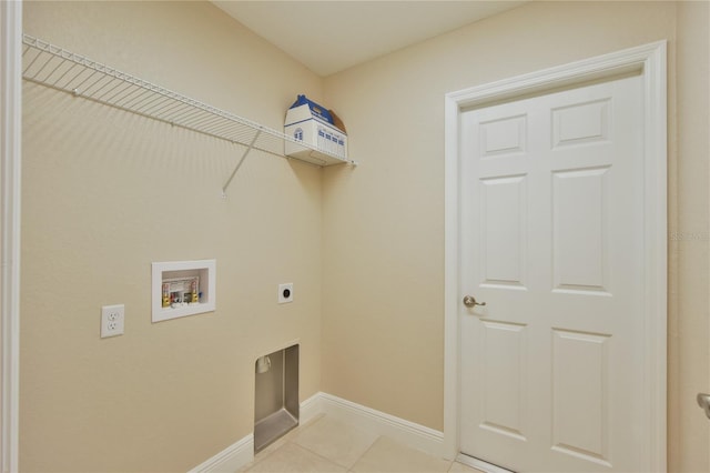 laundry area featuring hookup for a washing machine, light tile patterned flooring, electric dryer hookup, laundry area, and baseboards