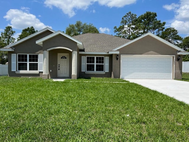 single story home featuring concrete driveway, a front lawn, and stucco siding