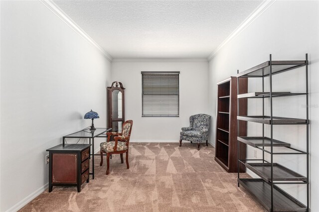 sitting room with a textured ceiling, carpet, baseboards, and crown molding