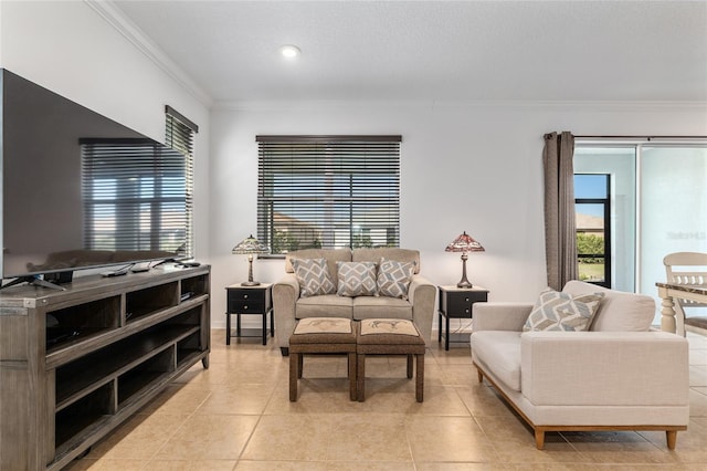 living area with light tile patterned flooring, crown molding, and baseboards