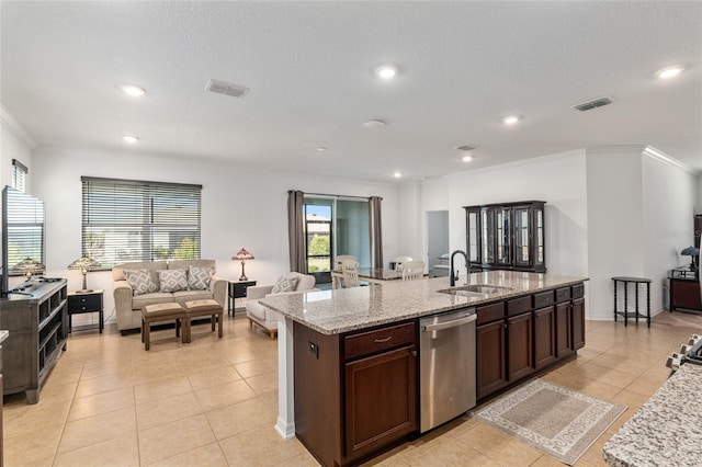 kitchen with a kitchen island with sink, visible vents, a sink, and stainless steel dishwasher