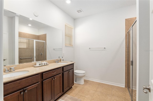 bathroom featuring double vanity, a sink, visible vents, and a shower stall