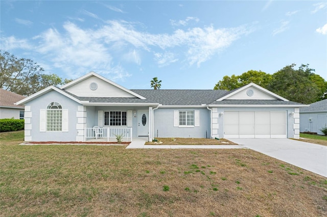 ranch-style home with concrete driveway, roof with shingles, an attached garage, covered porch, and a front yard