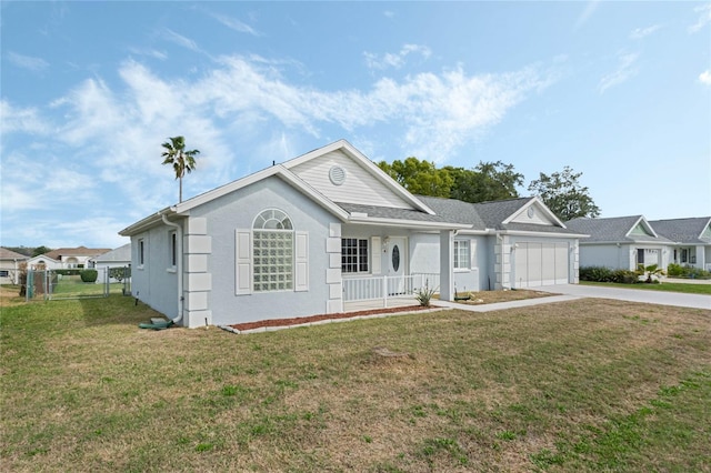 ranch-style house featuring a porch, an attached garage, driveway, stucco siding, and a front yard