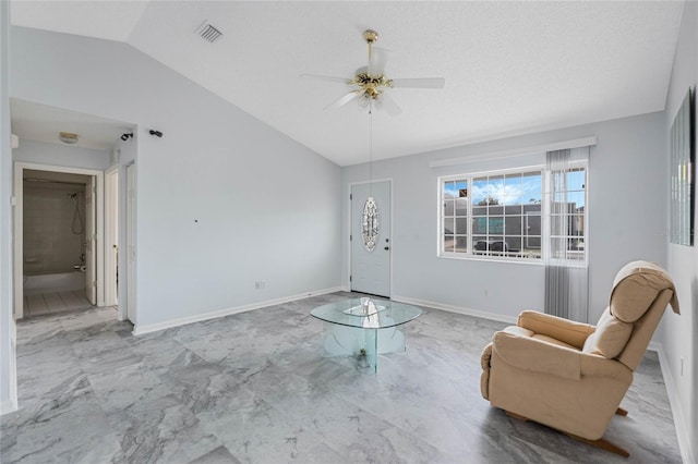 interior space featuring lofted ceiling, marble finish floor, visible vents, and baseboards