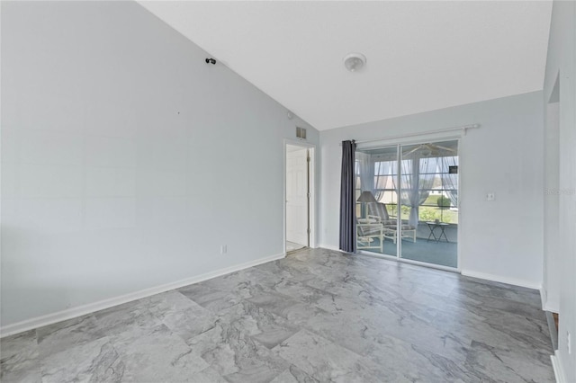 spare room featuring marble finish floor, visible vents, baseboards, and vaulted ceiling