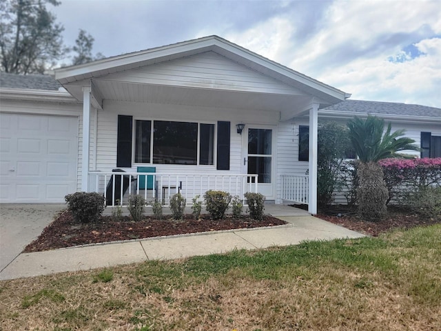 view of front of home with covered porch and an attached garage