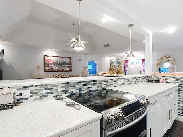 kitchen featuring light countertops, stainless steel range with electric cooktop, visible vents, and white cabinetry