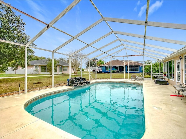 outdoor pool with glass enclosure, a lawn, and a patio area