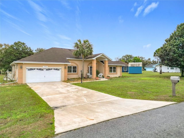 single story home featuring a garage, a front yard, concrete driveway, and stucco siding