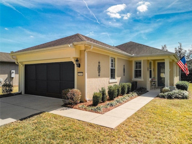 ranch-style house featuring a shingled roof, concrete driveway, an attached garage, a front lawn, and stucco siding