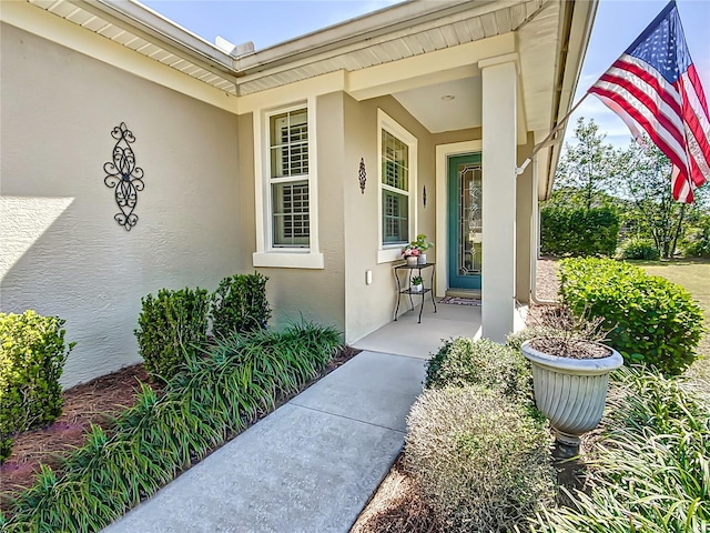 doorway to property with stucco siding