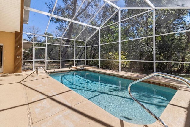 outdoor pool with a patio and a lanai