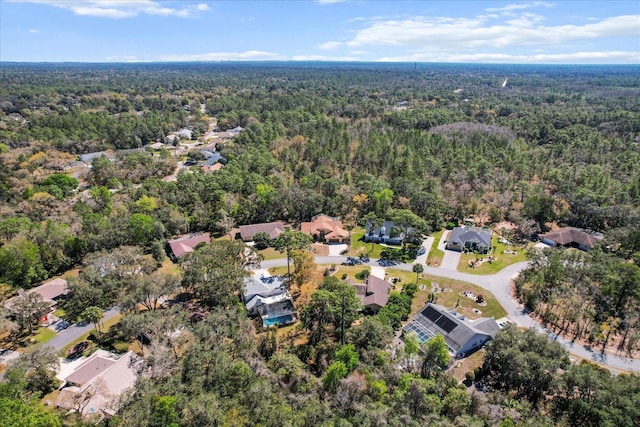 aerial view featuring a residential view and a view of trees