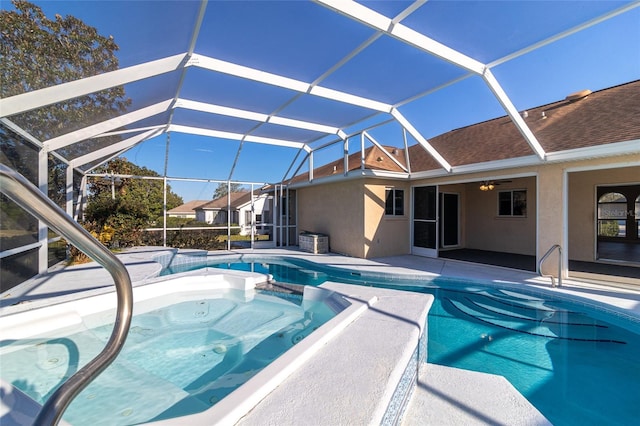 view of swimming pool featuring a lanai and a patio area