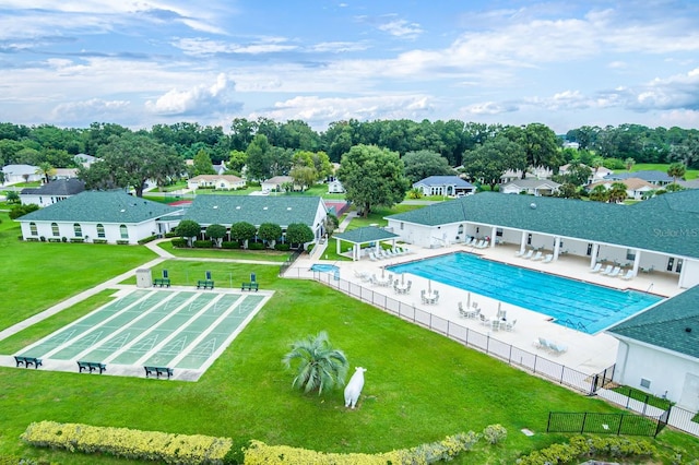 community pool featuring a patio, fence, a gazebo, a yard, and a residential view