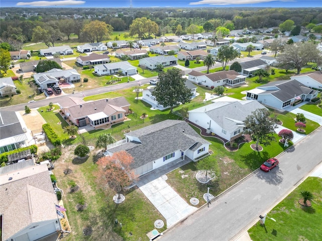 birds eye view of property with a residential view