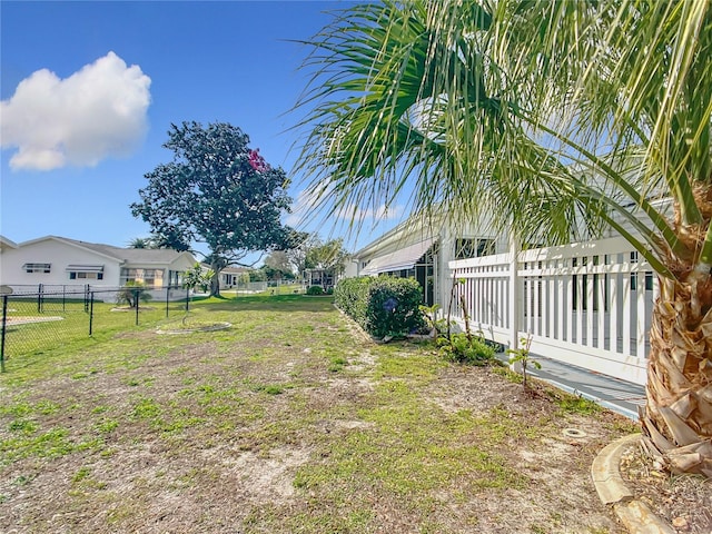 view of yard with a residential view and fence