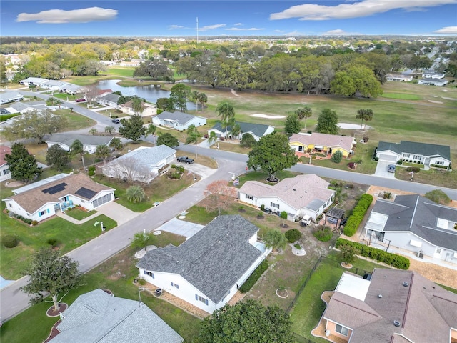 birds eye view of property featuring a water view and a residential view