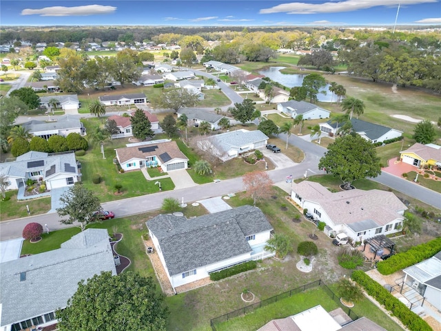 bird's eye view with a water view and a residential view