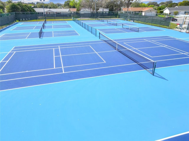 view of tennis court with fence