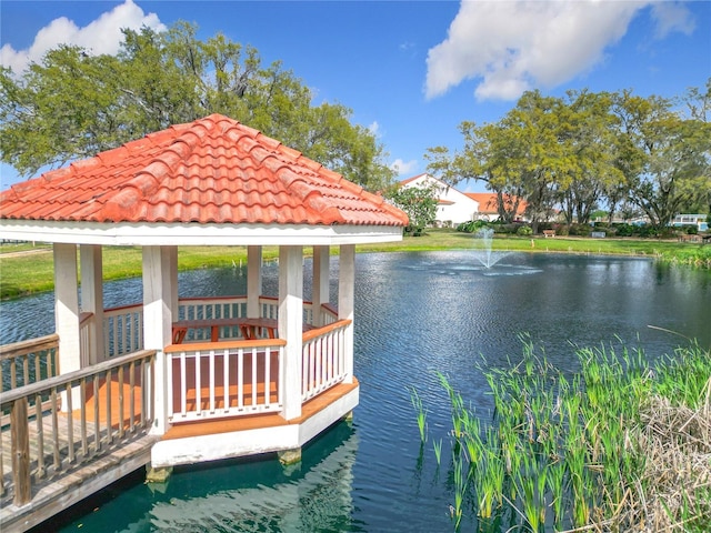 dock area with a water view and a gazebo