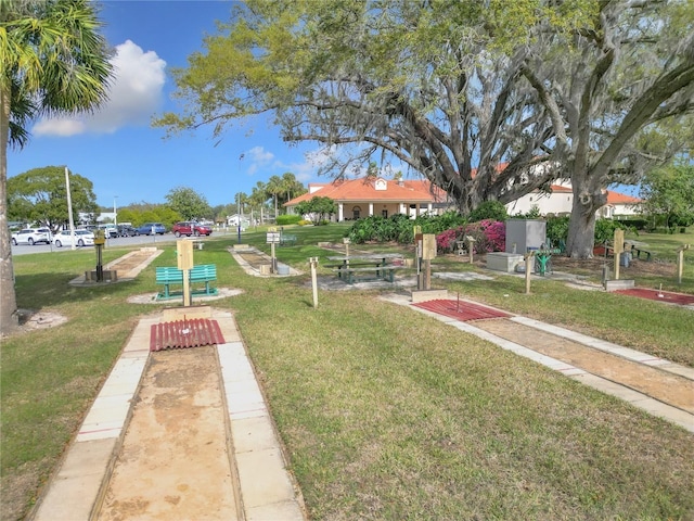 view of property's community with a lawn