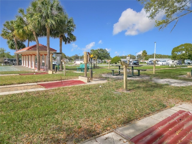 view of home's community featuring a lawn