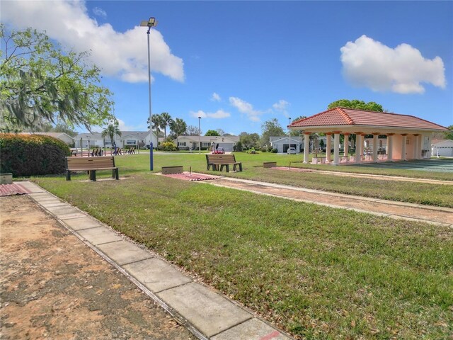 view of property's community featuring a yard and a gazebo