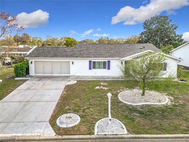 single story home with driveway, a shingled roof, a garage, and a front yard