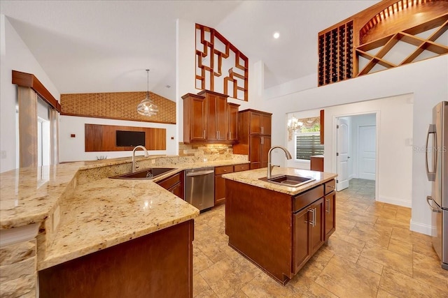 6307 SE 8th Ln, Ocala, FL 34472 - kitchen with a sink, lofted ceiling, appliances with stainless steel finishes, light stone counters, and a kitchen island with sink