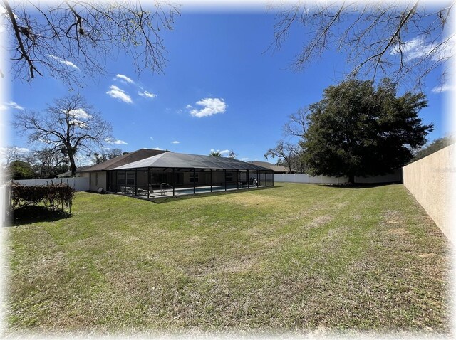 6307 SE 8th Ln, Ocala, FL 34472 - view of yard featuring a swimming pool and a lanai