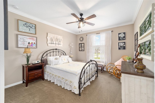 carpeted bedroom with ceiling fan, baseboards, and ornamental molding