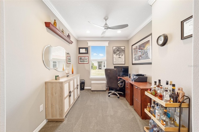 home office with baseboards, a ceiling fan, light colored carpet, and ornamental molding