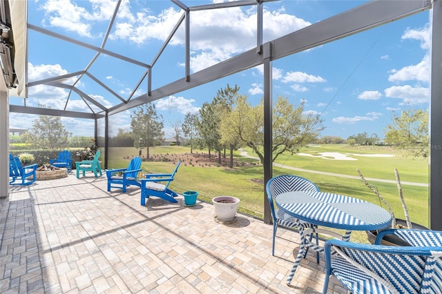 view of patio / terrace featuring a lanai and a fire pit