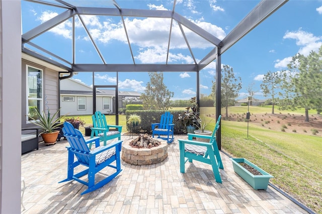 view of patio / terrace featuring a fire pit and a lanai