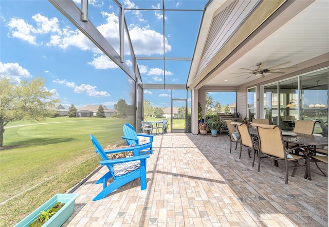 sunroom / solarium with ceiling fan