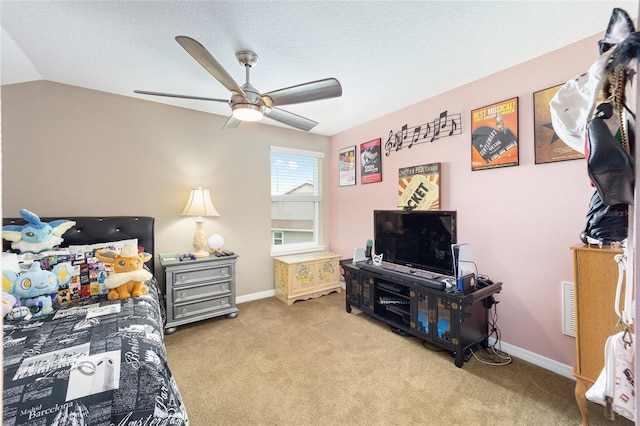 bedroom with a ceiling fan, visible vents, carpet floors, baseboards, and vaulted ceiling