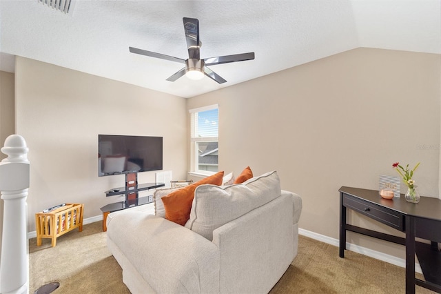 living room featuring visible vents, lofted ceiling, a ceiling fan, and carpet floors