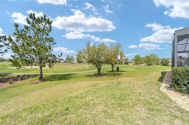 view of yard with view of golf course