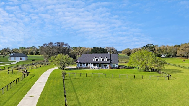 birds eye view of property featuring a rural view